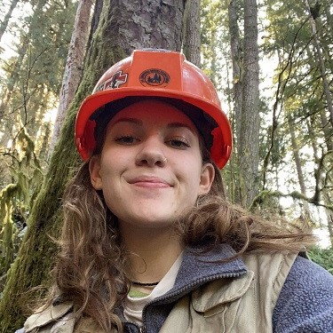 Maddie in hard hat and field vest