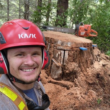 Sven cutting a stump